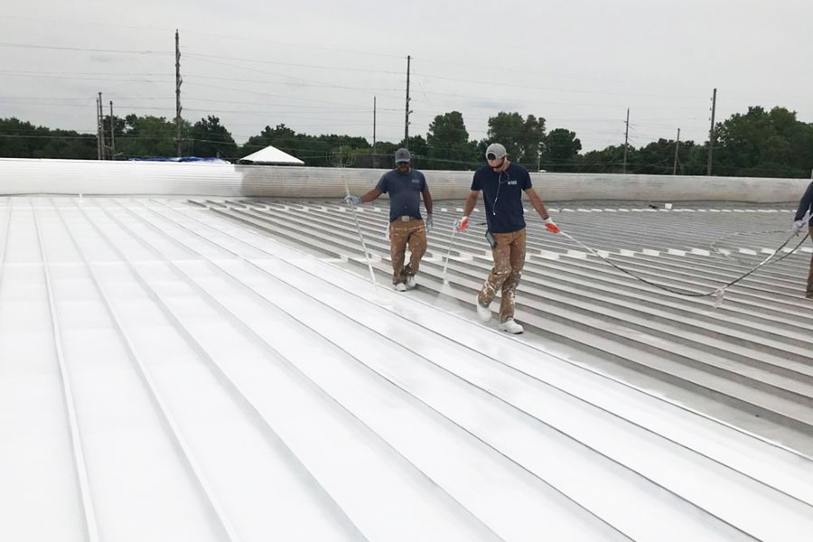 Picture of the team working on a roof | Safe Harbor Commercial Roofing | Knowify case study