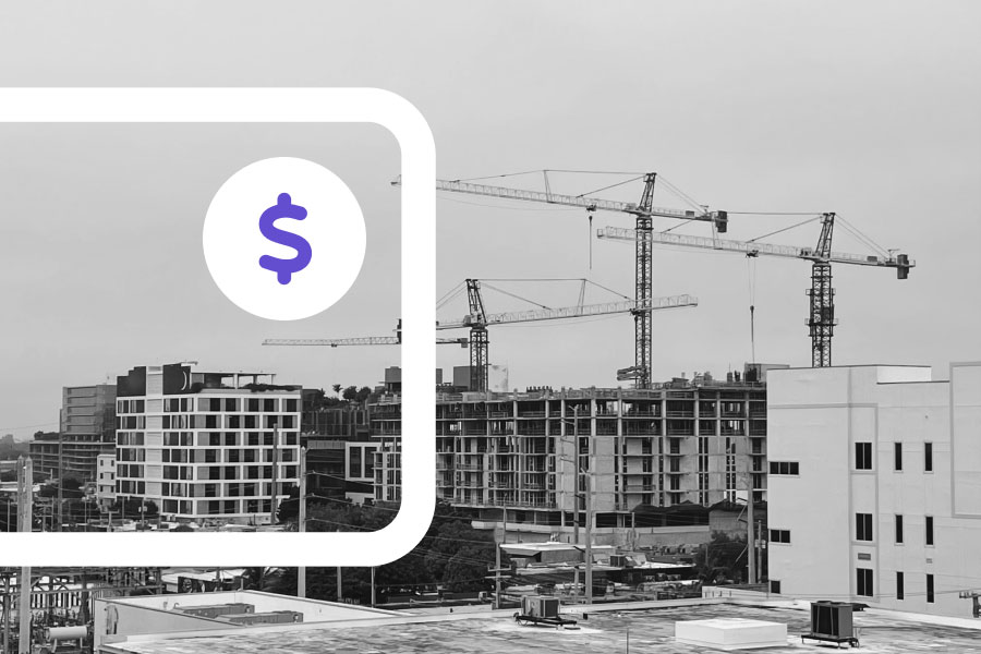 Picture of a construction site with an overlay of a dollar icon | How to use your line of credit | Knowify