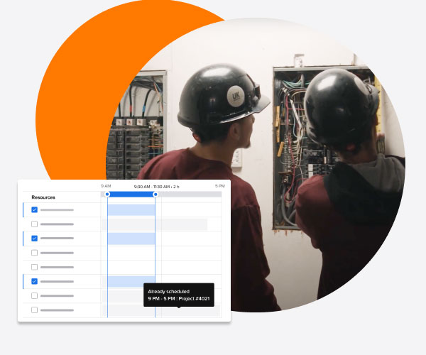 Picture of two electrical contractor working on a pane and product abstraction for scheduling and team management | Features | Knowify